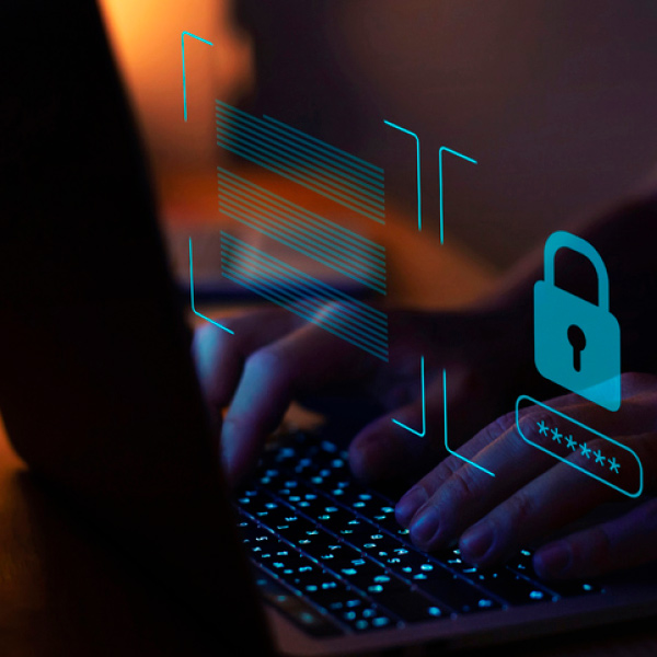 Hands typing on a computer 