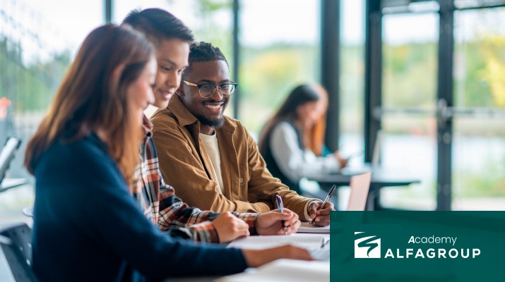 Group of students talking and smiling in a classroom